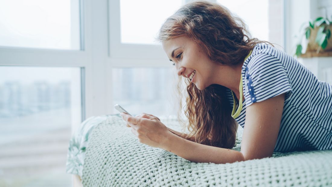 Customer texting, relaxing at home